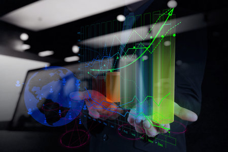 double exposure of businessman hand working with new modern computer and business strategy as...