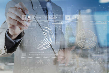 businessman hand working with modern technology and digital layer effect as business strategy conceptの写真素材
