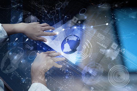 top view of businessman hand working with modern technology and digital layer effect as business...