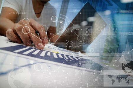 businessman hand working with modern technology and digital layer effect as business strategy conceptの写真素材