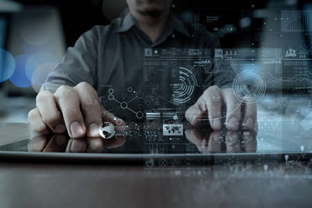 businessman hand working with modern technology digital tablet computer and digital layer effect as business strategy concept businessman hand working with modern technology digital tablet computer and digital layer effect as business strategy concept