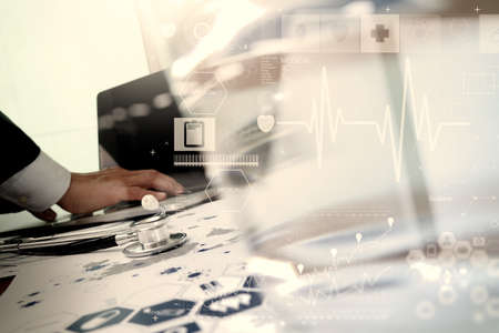 doctor working with laptop computer in medical workspace office and medical digital network media diagramas conceptの写真素材