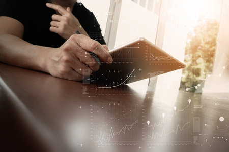 businessman working with digital tablet computer with digital business strategy layer effect on...