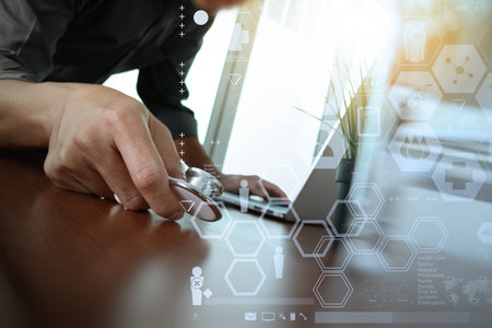 doctor working with laptop computer in medical workspace office and medical network media diagram...