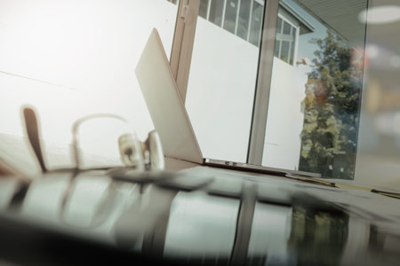Office workplace with laptop and business document with calculator and eyeglass on wood table