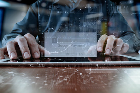 hands using digital pro tablet with Secure payment on the screen as Online shopping concept