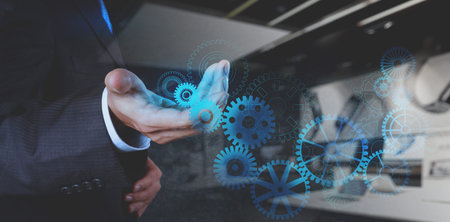 double exposure of businessman hand working with cog gear to success as concept