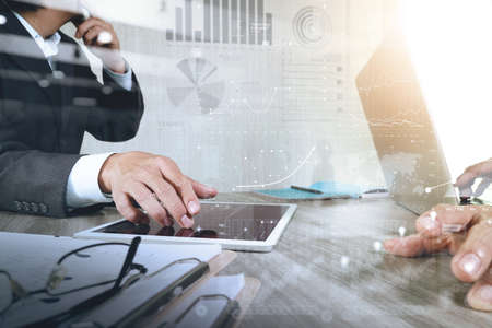 Businessman making presentation with his colleagues and business strategy digital layer effect at the office as conceptの写真素材