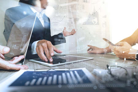 Businessman making presentation with his colleagues and business strategy digital layer effect at the office as conceptの写真素材