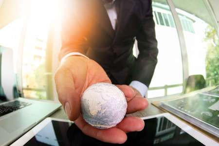 close up of businessman hand showing texture the world with digital social media network diagram conceptの写真素材