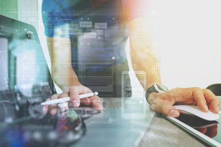 Website designer working digital tablet and smartphone and laptop computer with digital design...