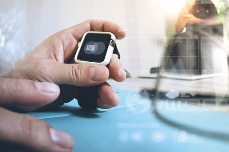 business presentation meeting on office table with smart watch and laptop computer and graph...