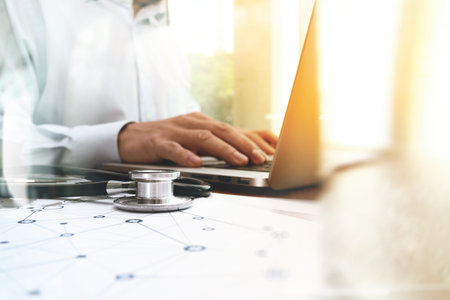 Medicine doctor hand working with modern computer interface as medical network concept