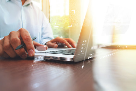 businessman hand working with new modern computer and digital business strategy diagram as concept