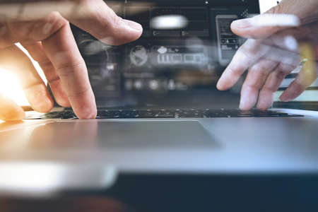 designer moving hands working with laptop computer and digital web design diagram as conceptの写真素材