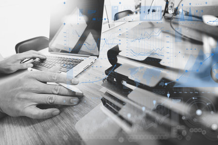 business documents on office table with smart phone and digital tablet and graph business with...