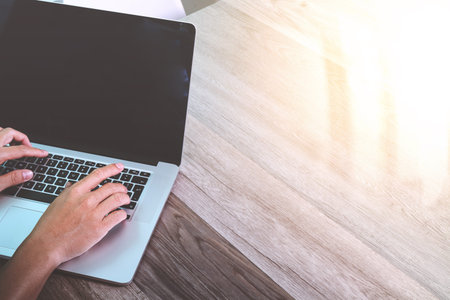 businessman hand working with stylus pen digital tablet smart phone and laptop computer. attending video conference in modern office. On wood desk. View from top. Double exposure effects, Minimalismの写真素材