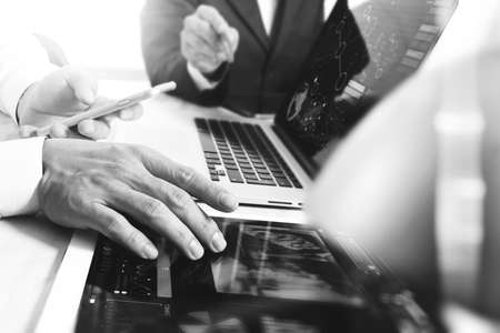 Business team meeting present. Photo professional investor working with new startup project. Finance managers meeting.Digital tablet laptop computer design smart phone using, black whiteの写真素材