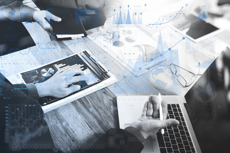 Businessman making presentation with his colleagues and business strategy digital layer effect at...