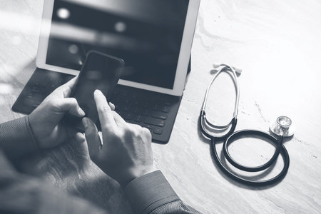 Medical technology concept. Doctor hand working with modern digital tablet dock screen computer with...