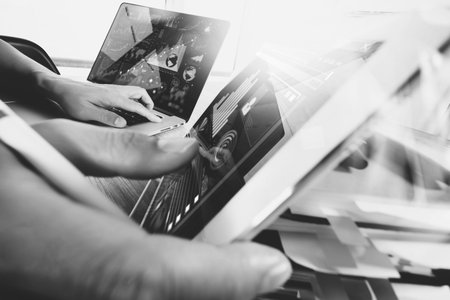 business documents on office table with smart phone and digital tablet and graph business with stack...