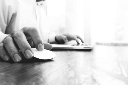 businessman hand working with new modern computer and digital business strategy diagram as concept,black and whiteの写真素材