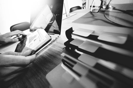 business documents on office table with smart phone and digital tablet and graph business with...