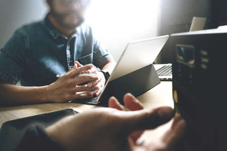 Business team meeting present. professional investor working new startup project. Finance managers meeting.Digital tablet keyboard docking screen computer design smart phone usingの写真素材