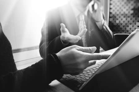 Business team meeting present. professional investor working new startup project. Finance managers meeting.Digital tablet keyboard docking screen computer design smart phone using, black whiteの写真素材