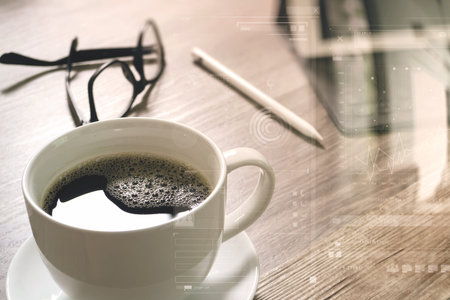 Coffee cup and Digital table dock smart keyboard,eyeglasses,stylus pen on wooden table,filter...