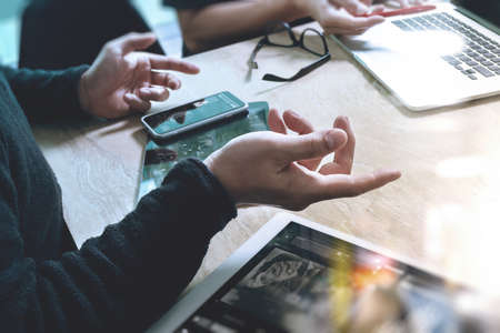 Business team meeting present. Photo professional investor working with new startup project. Finance managers meeting.Digital tablet laptop computer design smart phone using, Sun flare effect
の写真素材