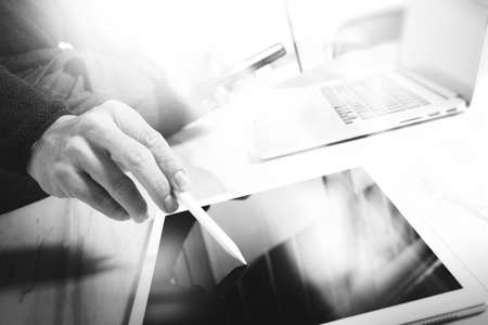 Designer hand working with laptop computer on marble desk as responsive web design concept, black whiteの写真素材