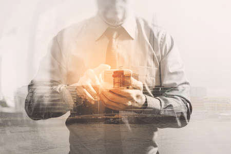Double exposure of success businessman using smart phone with London building,city,front view,filter effectの写真素材