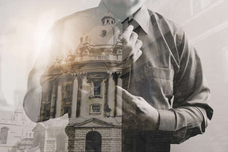 Double exposure of success businessman holding neck tie with London building,Oxford,front view,filter effectの写真素材