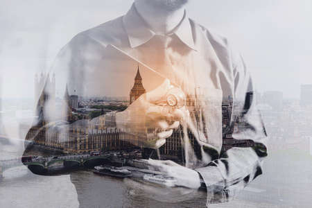 Double exposure of smart medical doctor holding digital tablet computer,stethoscope with London city,Bigben,front view,filter effectの写真素材