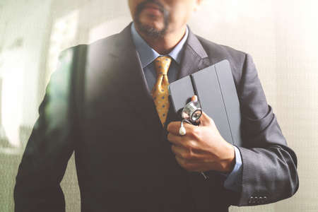 smart medical doctor holding digital tablet computer,stethoscope,front view,filter effectの写真素材