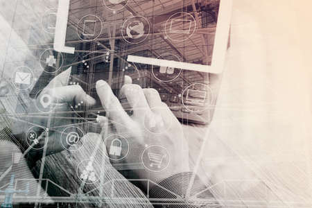 Double exposure of Hand using smart phone payments online shopping,omni channel,icon customer network,in modern office wooden desk,London city buildingsの写真素材