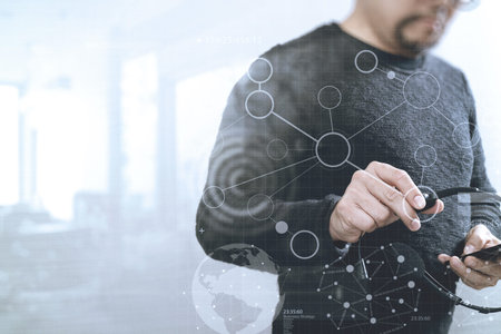Man using VOIP headset with smart phone, concept communication, it support, call center and customer service help desk,digital screen graphic virtual icons,graph,diagramの写真素材