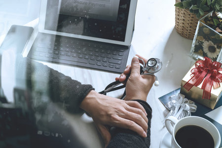 Gift giving,medical doctor Hand with credit card and hand with gift. Gift delivery, surprise,laptop...