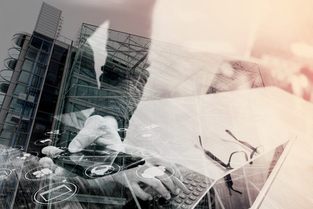 Double exposure of Businessman hand using mobile payments online shopping,omni channel,in modern...