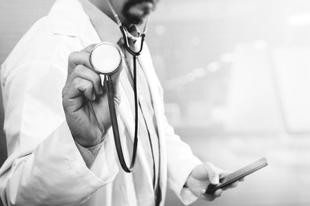 Medical technology concept. Doctor hand working with modern smart phone with medical chart...
