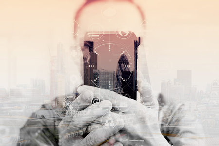 Double exposure of Designer hand using mobile payments online shopping,omni channel,in modern office...