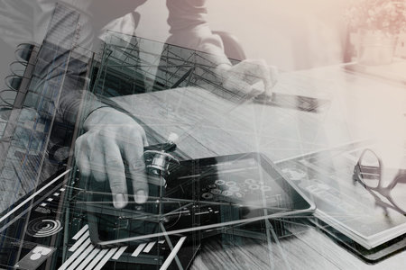 Double exposure of Doctor working with digital tablet computer with smart phone in medical workspace...