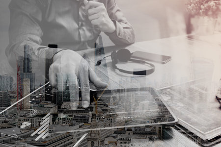 Double exposure of Businessman hand using VOIP headset with digital tablet computer,document,concept...