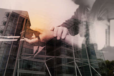 Double exposure of Man using VOIP headset with digital tablet computer docking smart keyboard, concept communication, it support,London architecture bulidingsの写真素材