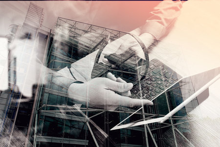 double exposure of man hand using VOIP headset with digital tablet computer docking keyboard,smart phone,concept communication, it support, call center and customer service help desk,London architecture cityの写真素材