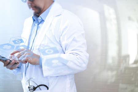 Medical technology concept. Doctor hand working with modern smart phone with medical chart interface,multi channel connection,white backgroundの写真素材