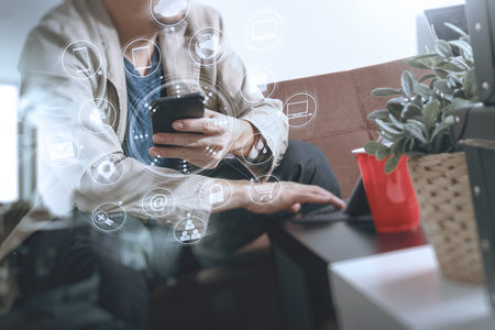 hipster hand using smart phone,digital tablet docking keyboard,coffee cup, payments online...