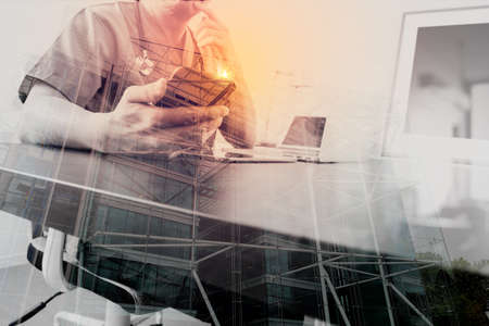 Medical technology concept.Doctor hand working with smart phone and laptop with digital tablet computer in modern clinic office with London city background,double exposureの写真素材