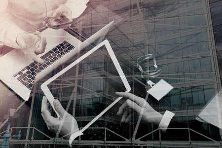 co working team meeting concept,businessman using smart phone and digital tablet and laptop computer and name tag in modern office with London city exposureの写真素材